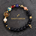 Sagittarius zodiac gemstone bracelet with Jupiter blue, red agate, black onyx, and gold-tone charm by Velastrand