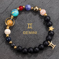 Gemini zodiac gemstone bracelet with turquoise, lapis-tone bead, black onyx, and gold-tone charm by Velastrand