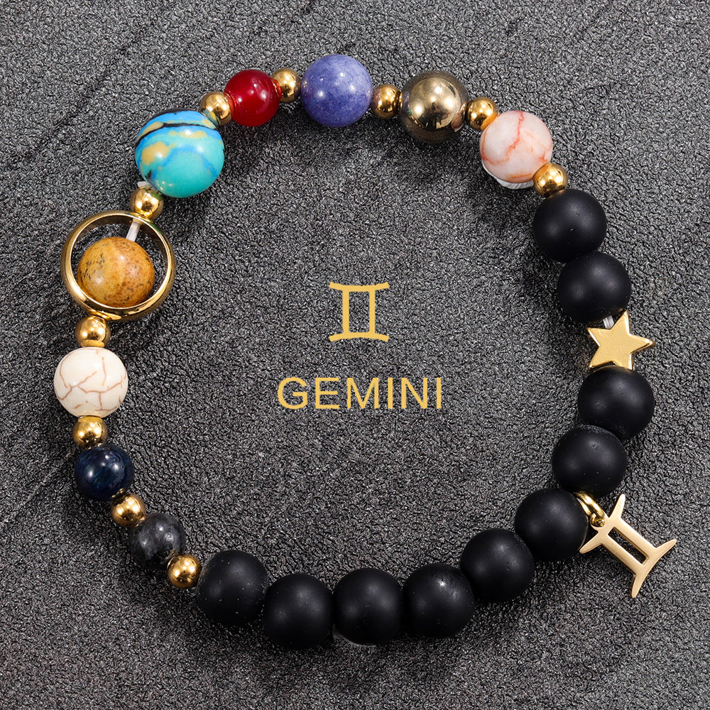 Gemini zodiac gemstone bracelet with turquoise, lapis-tone bead, black onyx, and gold-tone charm by Velastrand