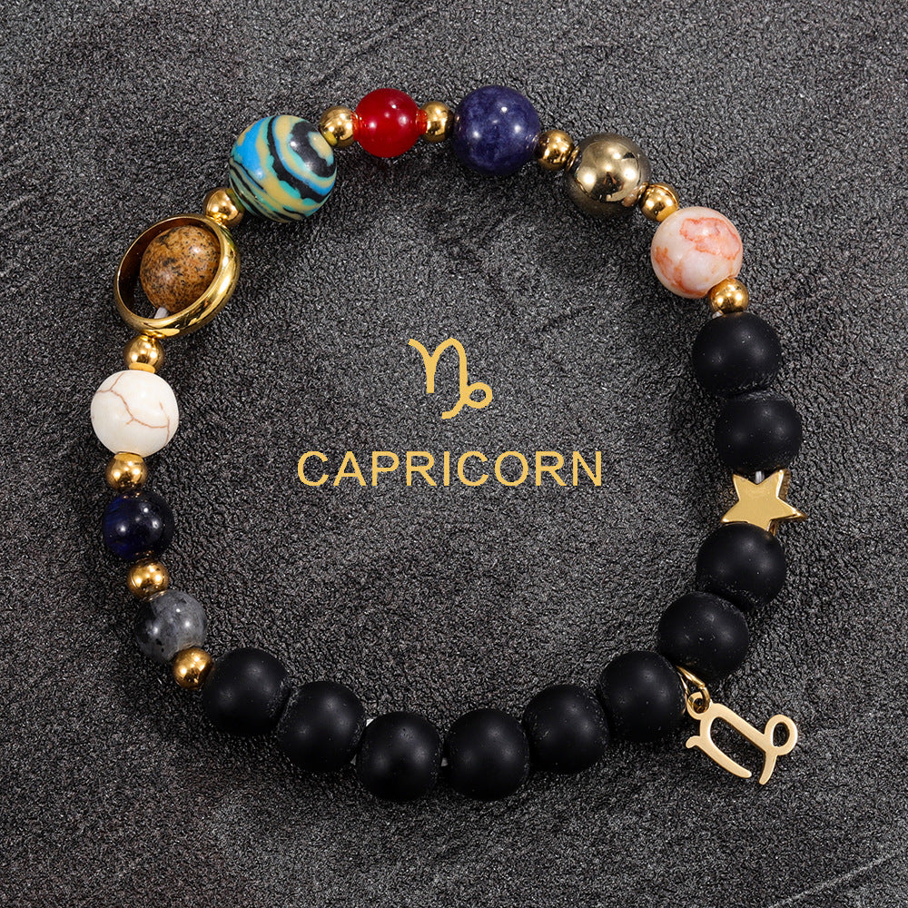 Capricorn zodiac gemstone bracelet with turquoise jasper, black onyx, and gold-tone charm by Velastrand
