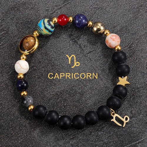 Capricorn zodiac gemstone bracelet with turquoise jasper, black onyx, and gold-tone charm by Velastrand