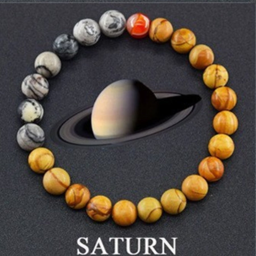 Saturn Ring planet gemstone bracelet with black agate, tiger eye, and gold accents by Velastrand